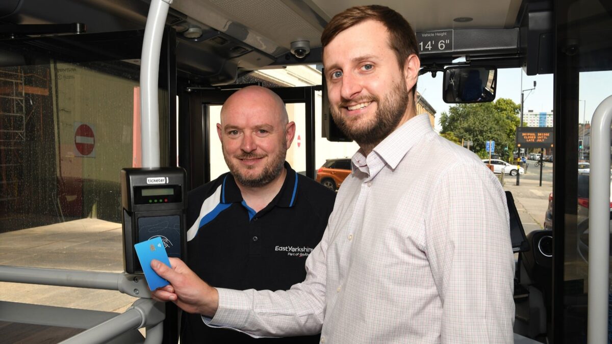 Councillor Nick Coultish and Stuart Fillingham show the new Tap On, Tap Off technology installed on East Yorkshire Buses.